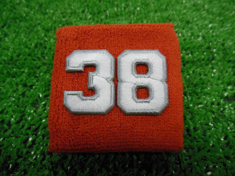 Texas Orange  -  Wristbands with White Embroidered Numbers