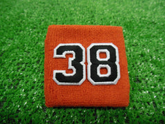 Texas Orange  -  Wristbands with Black Embroidered Numbers